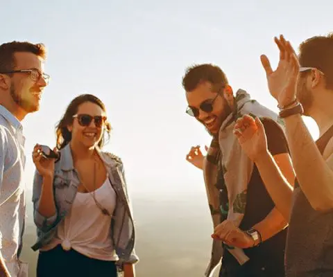 group of friends laughing and smiling