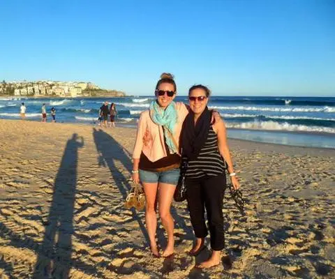 There’s so much to see out there – why wait! Travelers smile from Bondi Beach, Australia. 