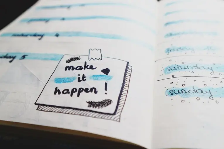 make it happen written on a notebook