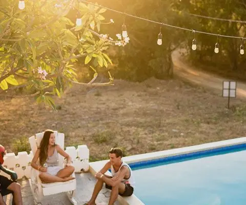 Friends enjoying a relaxing sunset together