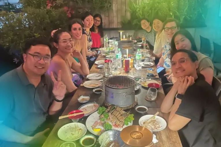 Enjoying dinner in Bangkok with co-workers and interns after work during an internship abroad.