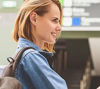 girl handing over her passport