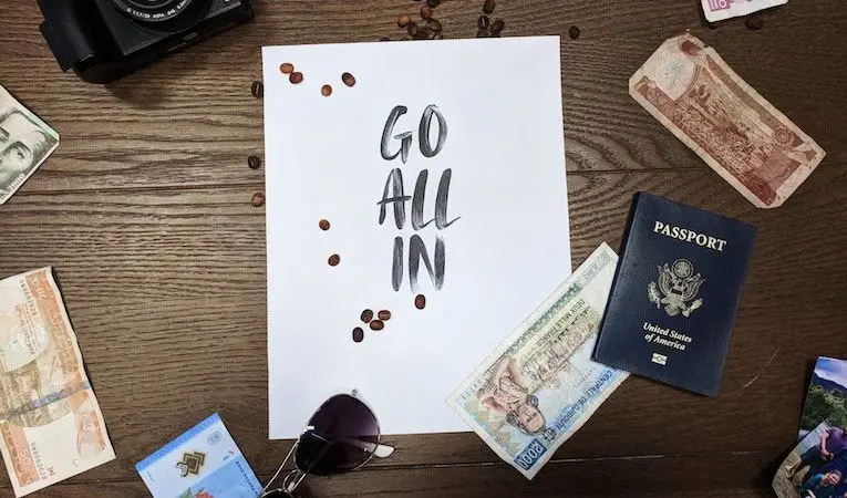 Flatlay of foreign currency and passport