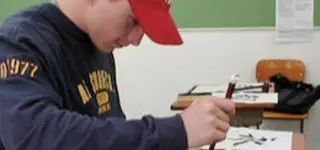 Student learning Japanese writing