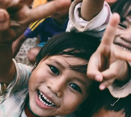 kids smiling on an affordable volunteer program