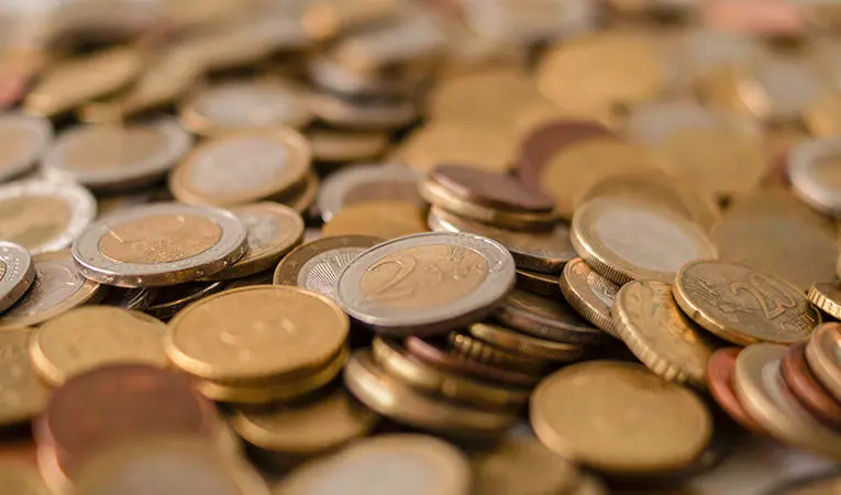 silver and bronze euro coins close up