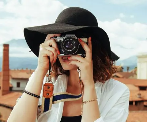 woman snapping a picture with her camera