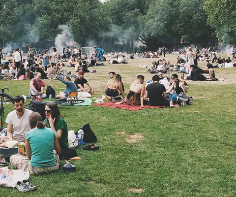 People picnic in the London fields, London