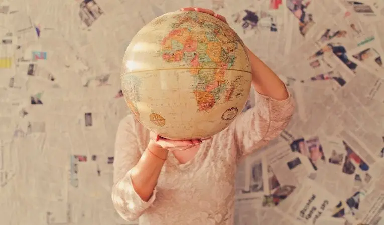 Woman holding a globe