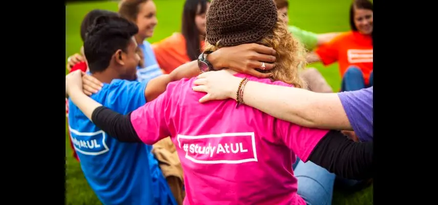 Students arms linked and T-Shirt reads  #study at UL 