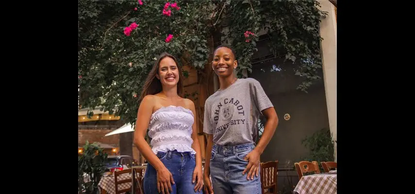 Two students smiling to the camera
