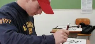 ITA teacher sitting on the floor with her students