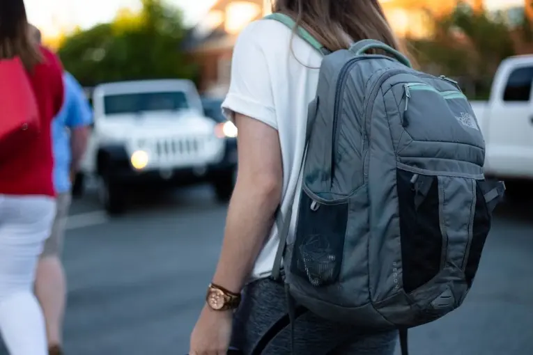 person walking with backpack